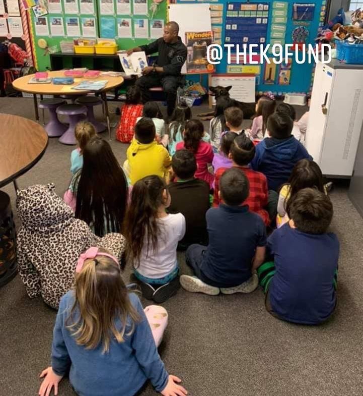 TheK9Fund's tweet photo. LAPD Metropolitan K9 Platoon Chief Trainer Sgt. Goosby & K9 Cash recently participated in Read Across America. Thank you to these wonderful educators and students. #ReadAcrossAmerica #K9Cash #TheK9Fund #LAPDK9 https://t.co/cXpMLCYzA3