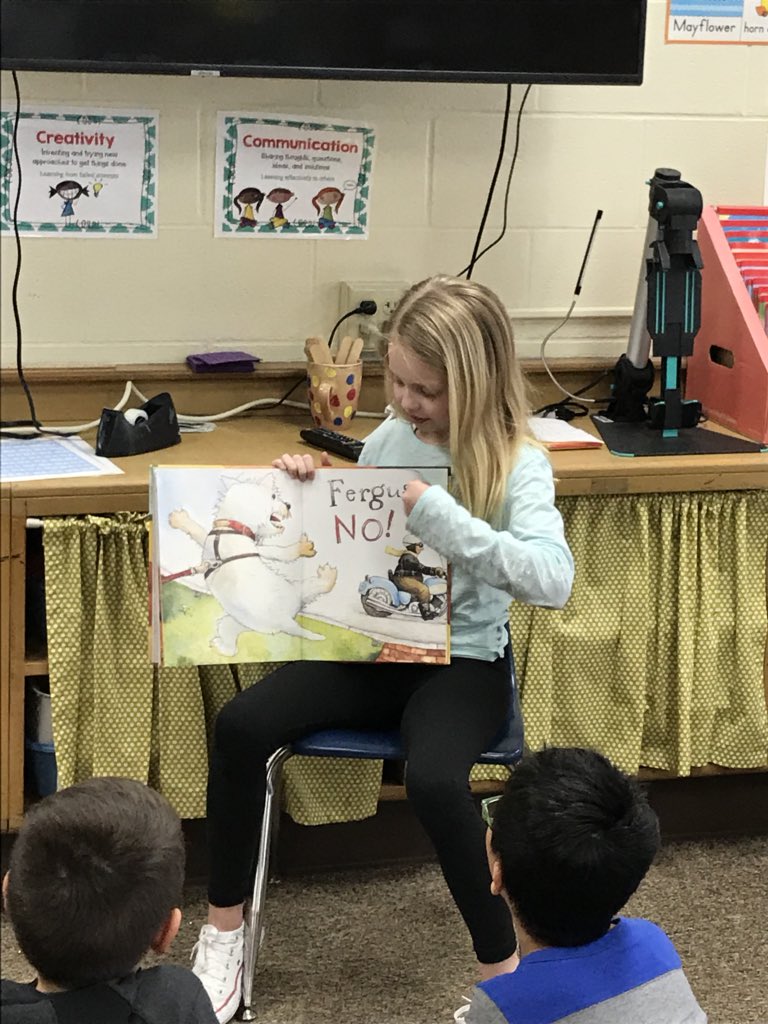 Strohscher2nd's tweet photo. March Madness: Battle of the Books 📚 
Round One: 
Reading their favorite book to the class. #TrojanTrue https://t.co/qBt2IQDjnD