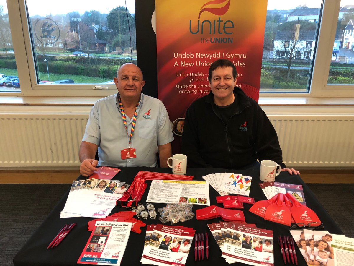 Gary John Unite the union ABMU branch secretary and Rob Morgan Unite Organiser helping out at the Unite the union stall at the ABMU mental health and learning disability event today at Liberty Stadium