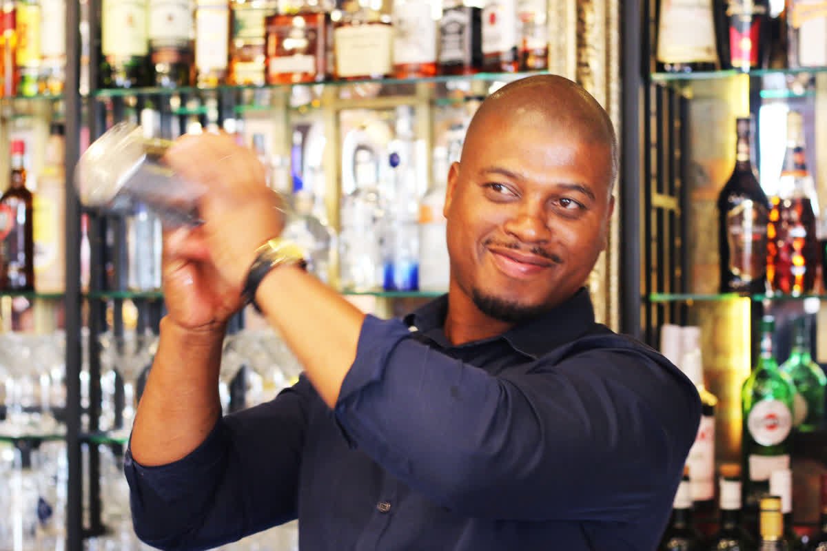 VivaldiCT's tweet photo. This is Sivu, about to make someone’s day with a just-shaken, colourful cocktail on a gorgeous Cape Town summer’s night. https://t.co/DVMOW2isg4