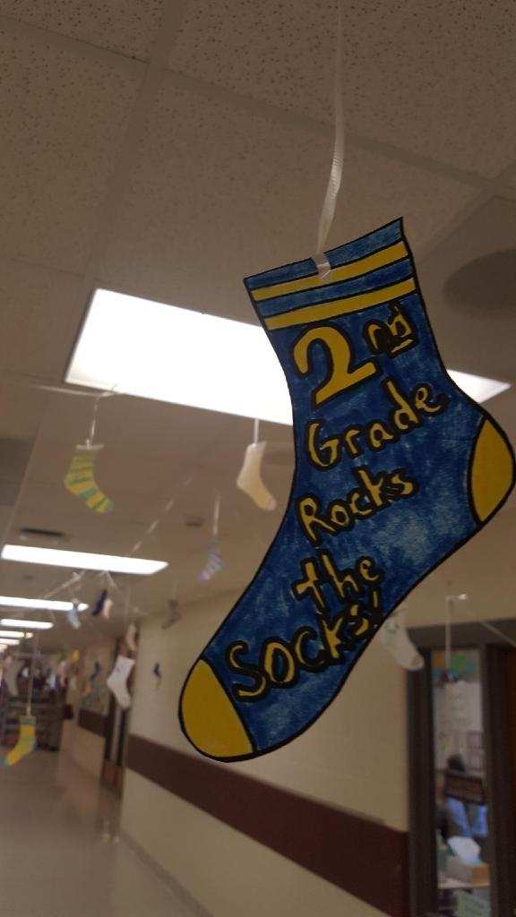 LinnIASheriff's tweet photo. SRO Deputy Hughes was at @NorthLinnLynx today to celebrate #WorldDownSyndromeDay. James and Kasyn gave all the students and teachers two thumbs up for doing a Down right awesome job! 👍🧦 https://t.co/W53aUV7Ef0