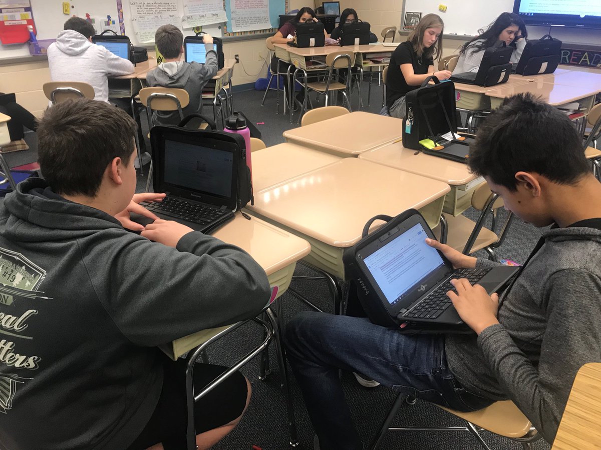 MrsReilly's tweet photo. Working hard with clock partners to identify two sides of the argument! #loganproud #clockpartners #flexiblegrouping #eighthgrade https://t.co/JbxM6J6czk