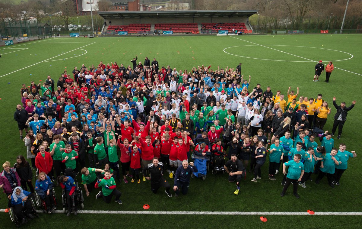 WelshRugbyUnion's tweet photo. Caerphilly @sport_leisure and @fields_trinity Disability Six Nations. It's grown from six schools 14 years ago to 22 with staff and volunteers ensuring 320 happy pupils took part in fun skills sessions and games today. Diolch 🙌 #RugbyForAll 😀 https://t.co/oVhZLXVVG5