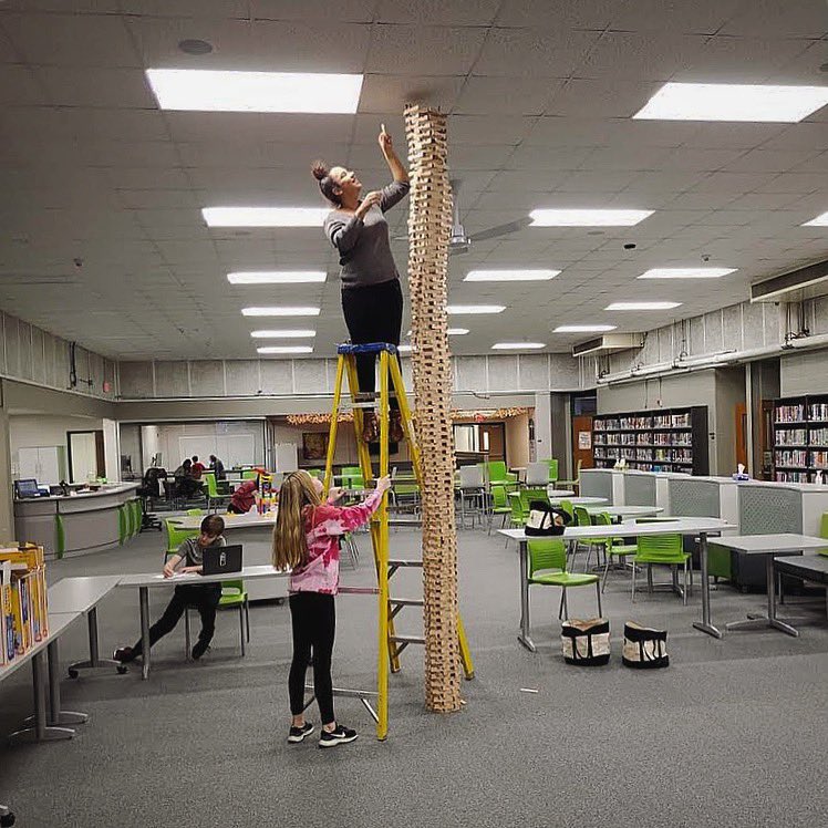 KEVAplanks's tweet photo. A steady hand and a helping hand can get you far. At least as far as the ceiling. #kevaplanks #buildamind https://t.co/u9qGijLE8r