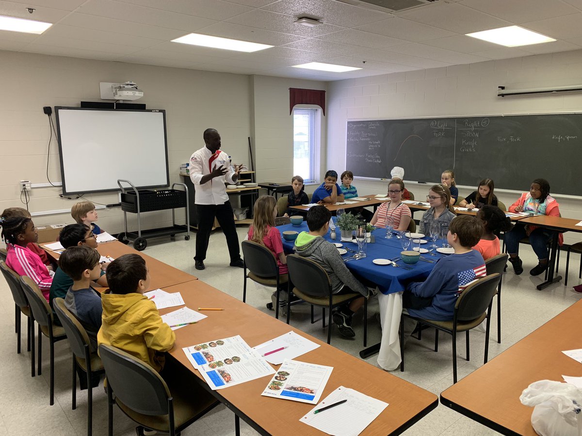 cville_schools's tweet photo. Executive Chef @ChefUlysse Charles took time this morning to teach fine dining etiquette to aspiring chefs at Tara Oaks Elementary School. @sodexoUSA https://t.co/IV2mbWrFcY