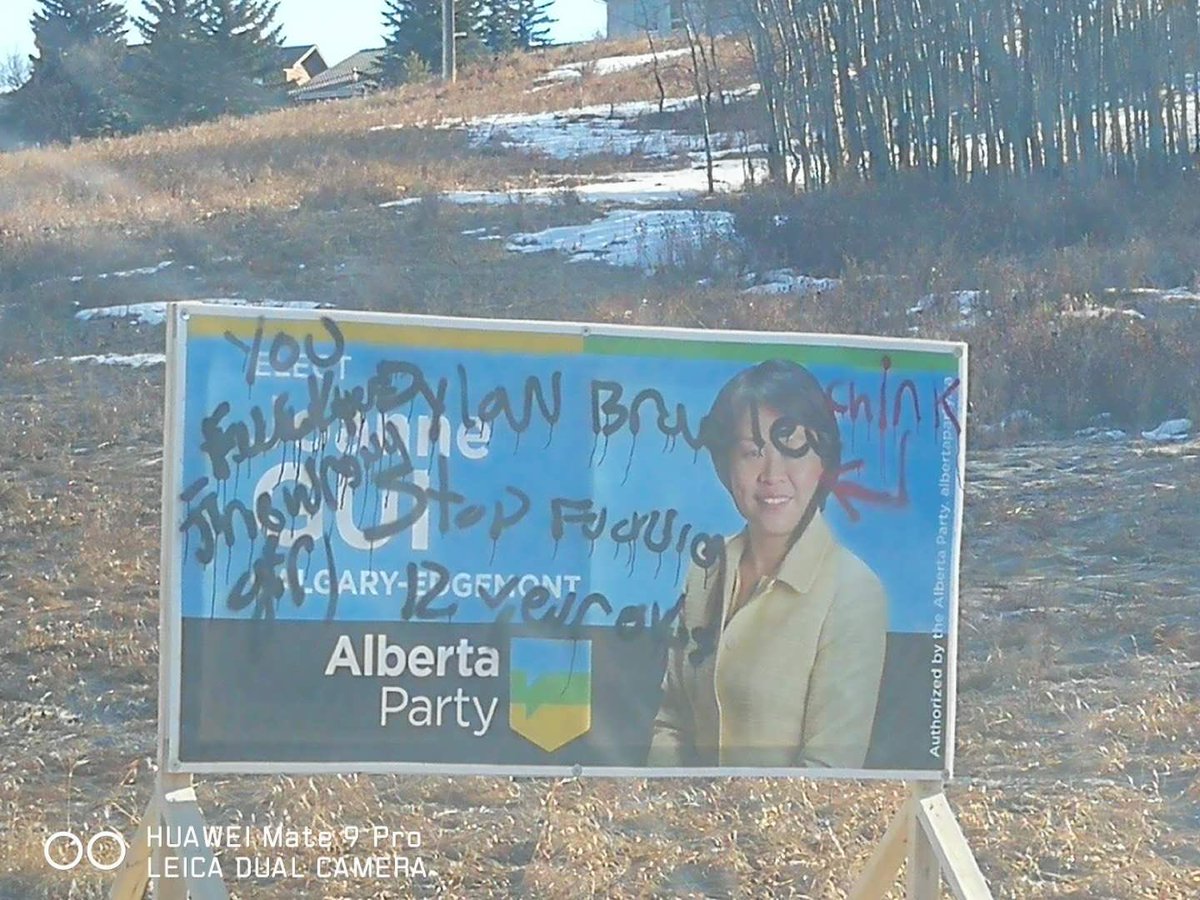 Not_ThatKaren's tweet photo. Today is the International Day to End Racism and this is what @AlbertaParty candidate @GuiJoanne has to deal with. This is outside of an elementary school. Absolutely vile @CBCCalgary @CTVCalgary @thestarcalgary @sprawlcalgary #abvote https://t.co/hTNvsixBEr
