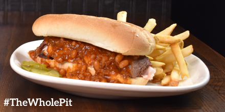 jackstackbbq's tweet photo. Does this #SparkJoy? YES! Smoked brisket and turkey come together under a blanket of hickory pit beans to create The Whole Pit Sandwich – now on our Spring Feature Menu for lunch. Served with fries! #TheWholePit #KCBBQ #JackStack #SparkJoy #LunchUpgrade https://t.co/cPgid7dgLO