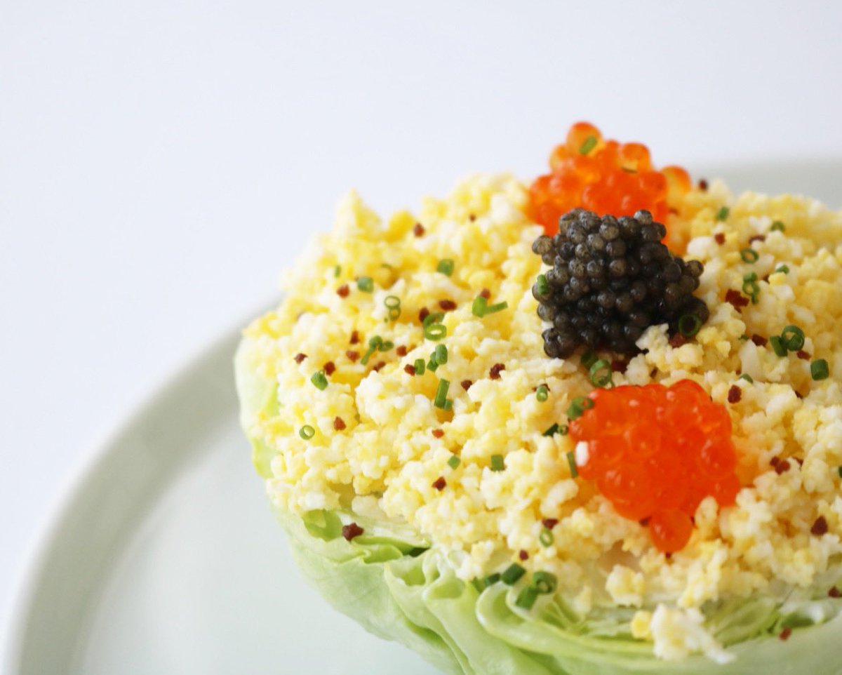 Baby Iceberg, Shaved Egg, Chives, Smoked Sturgeon Dressing, Caviar, Trout Roe, and Fleur de Maviar®.