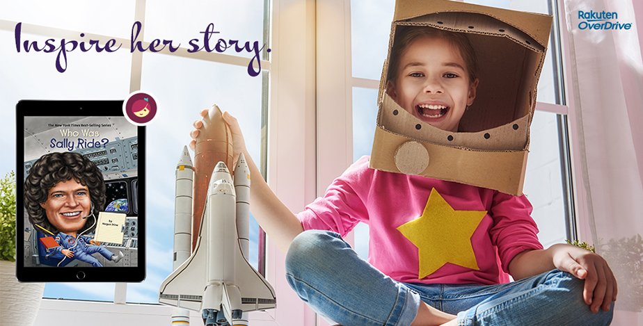 a litle girl smiling playing witha toy rocket ship