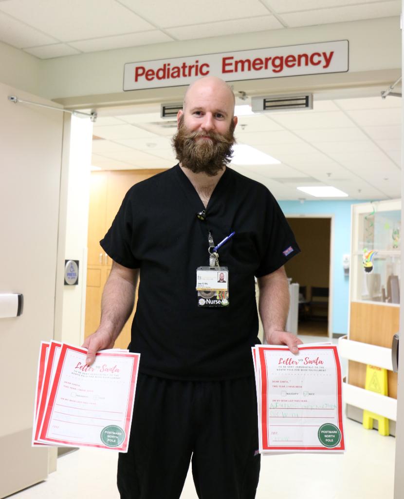 UIchildrens's tweet photo. #Nurse Joe Schmuecker set up a mailbox in our emergency department this past holiday season so pediatric patients could write letters to Santa. He then personally responded to all of them, usually around 2 a.m. at the end of his shift. 💛🖤 #pediatricnurse #uiowa https://t.co/71EXbt4XFI
