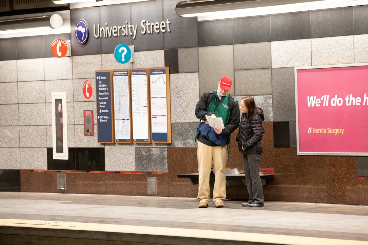 Metro's Jon Bez answers questions from a rider at University Street Station in the DSTT