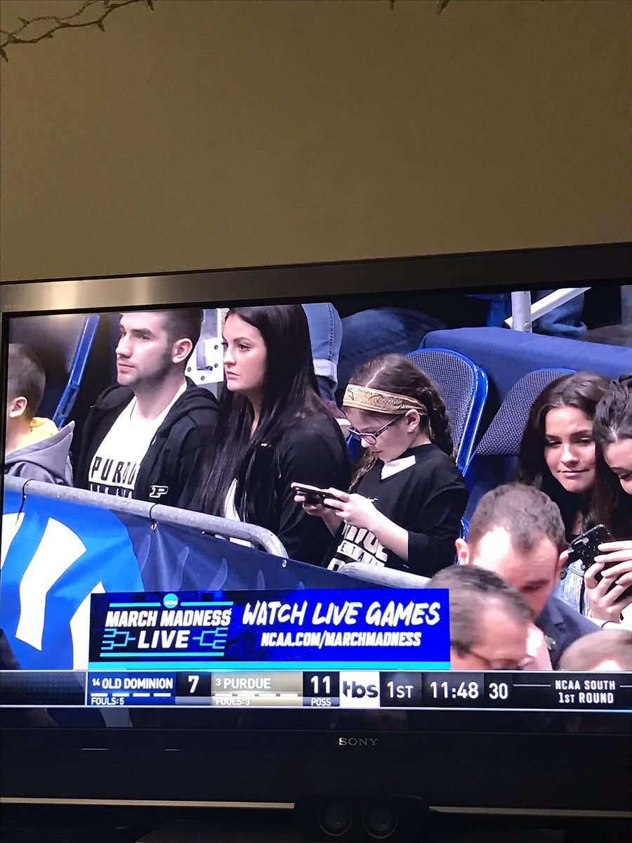shivam_nerd's tweet image. The NCAA is zooming in on the girl with the phone, and all I see Matthias to the left. I literally screamed “Suit Up!” at the TV to him.