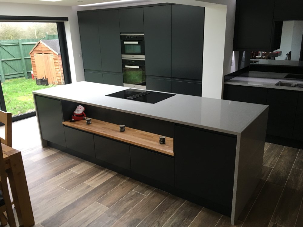 PrecisionKtchns's tweet photo. This island, finished with @Silestone Alumino Nube, divides the kitchen from the rest of the room. 
Kitchen side: practical storage cupboards and drawers. 
Living/dining side: beautiful oak shelf with LED lighting &amp; smaller storage cupboards.
#IslandLife #silestone #stylestone https://t.co/8DN8mfD6cr