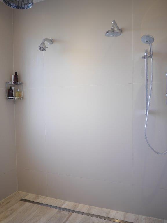 Spectacular en-suite showing how to use wood effect tiles perfectly, reaching right into the wetroom area for that seamless finish. 
  #freestandingtub #bathtime #woodtile   #tile #woodeffecttiles #wetroom #wetroomshower #twobasins #interiordesign #interiors #ukinteriors