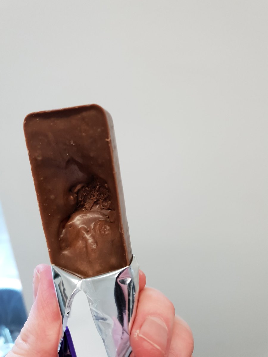 c_farren's tweet photo. @CadburyUK can someone explain these pictures to me? I just opened my wispa and there is a big hole in the back of it meaning I now have about 50% less chocolate. https://t.co/70KT3V6Txh