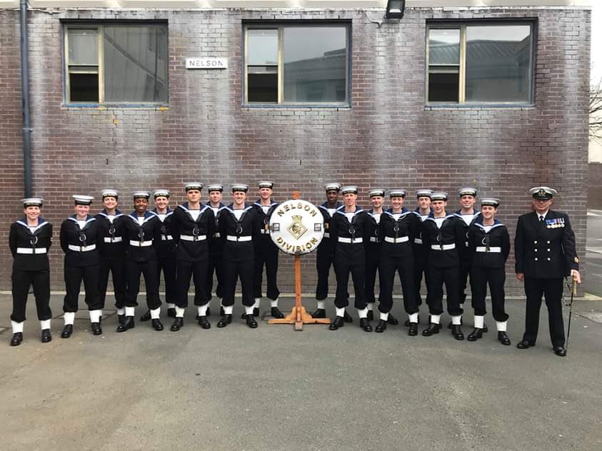 HMS_Raleigh's tweet photo. Here’s the #Nelson30s ready for their parade together with a picture of their Divisional staff.  Today is WO Foster’s final parade before he leaves for his next draft.  In his time at HMS Raleigh, he’s taken around 1,000 recruits through training. @HMSQNLZ @CaptDavidGeorge https://t.co/RsftMCQNp2