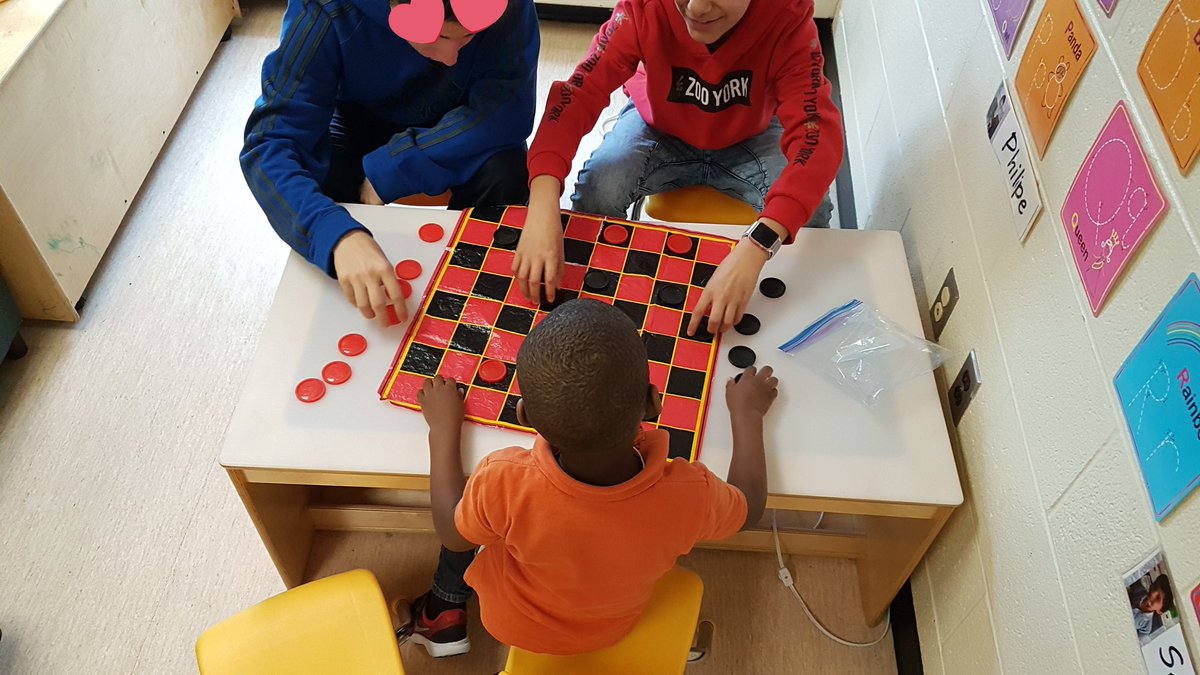 strk_ss's tweet photo. Learning how to play new games with our buddies! #turntaking #gr7leaders #rolemodels #math #socialskills #kindergarten https://t.co/uQDfWeEQ10