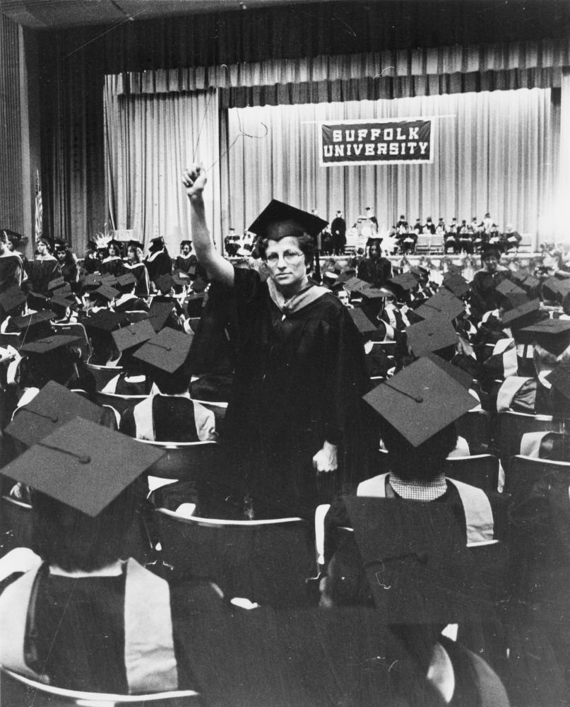 MoakleyArchive's tweet photo. Suffolk University students have always been strong advocates for causes they believe in, Here, a graduate raises a coat hanger in protest of anti-abortion efforts at the 1978 commencement. #WHM2019 https://t.co/VUobfHar30
