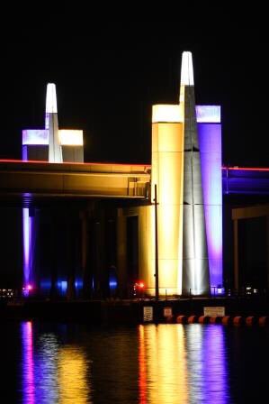 wsdot_520's tweet photo. Congrats to @ZagMBB for a dominant win yesterday! Our lights are staying reb/blue &amp; purple/gold this weekend to cheer on them, @ZagWBB &amp; @UW_MBB! We know you’ll be cheering to, just be sure to do it safely - aka, no watching while behind the wheel! #MarchMadness https://t.co/yxzwwVNoPa