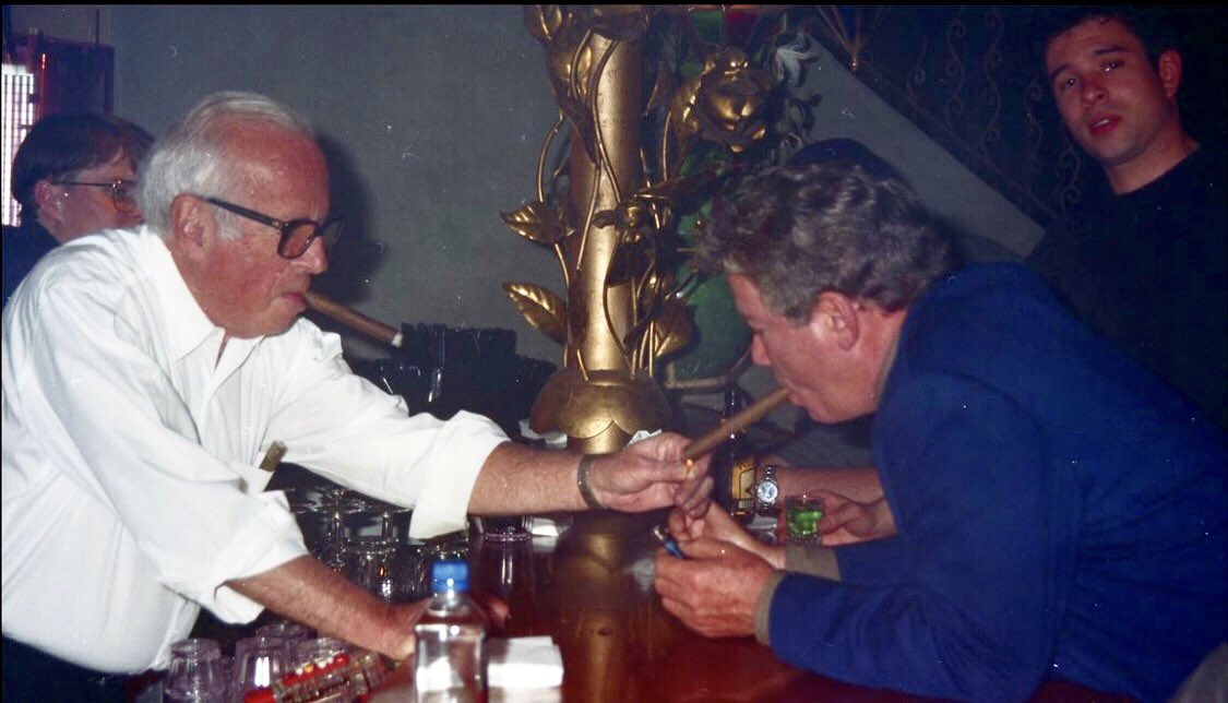 RMBee's tweet photo. On last night’s William Shatner Birthday appreciation episode of @ROBSERVATIONS2,  I tell the story of the time my late father, Richard Burnett, shared one of his cigars with Bill on the set of FREE ENTERPRISE. Here’s a photo of that very moment. HAPPY BIRTHDAY!!! @TBurnettwork https://t.co/THE5XuL3ut