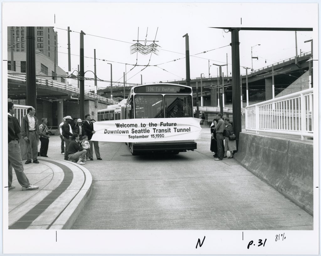 Route 106 passes through "Welcome to the Future. Downtown Seattle Transit Tunnel" banner Sept. 15, 1990.