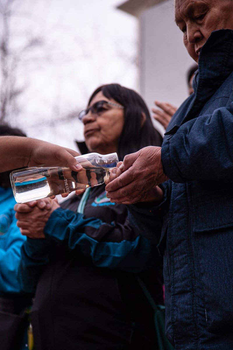 Elders who made the trip from @tsilhqotin territories had their hands washed with the water they were at the BC Court of Appeal this morning fighting for. Water from #FishLake. Photo by Trevor Mack. Read the story here: nationalobserver.com/2019/03/21/tsi… #WaterisLife #MniWiconi