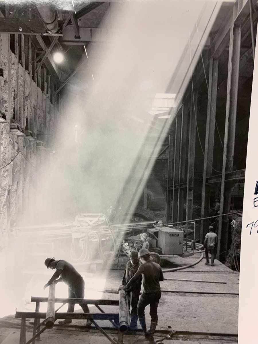 Sunlight shines on workers during the original construction of the Downtown Seattle Transit Tunnel.