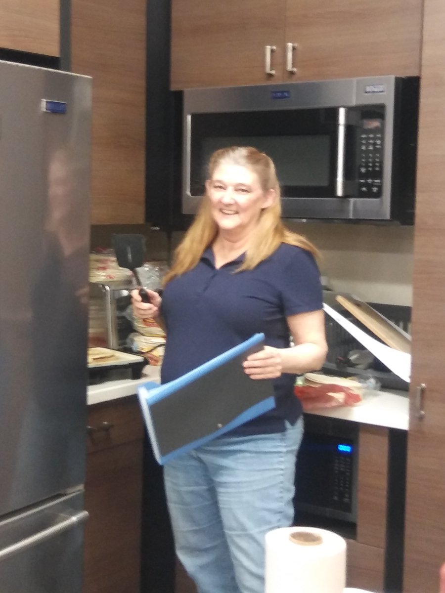 Reflections on the hill: Kathy showing off her muti-tasking skills. Being able to flip tortillas, and organize a file folder. Greatness! Keep up the great work.
