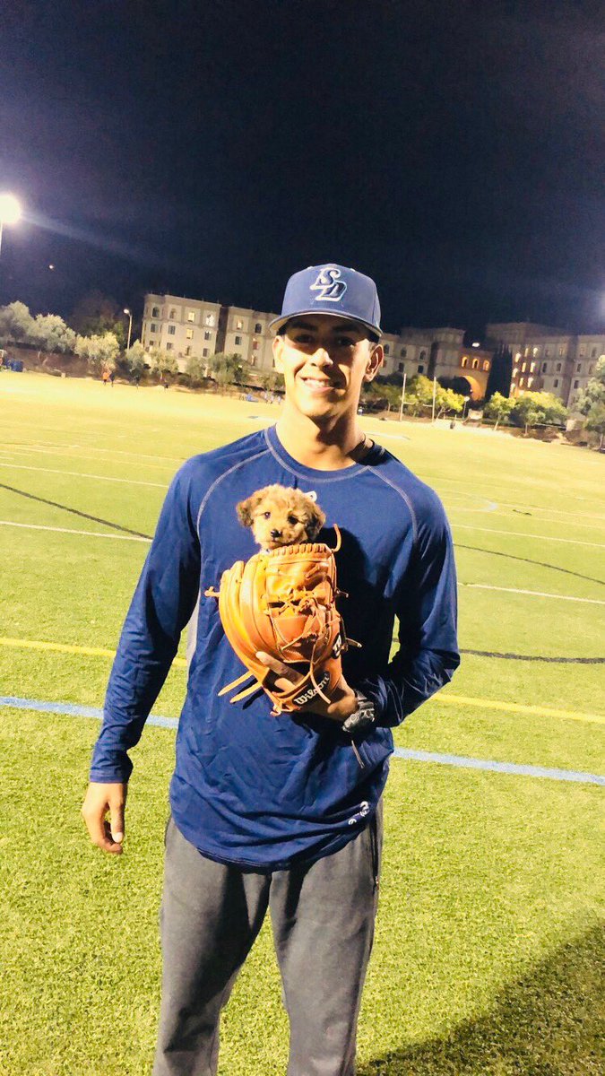 USDbaseball's tweet photo. I mean c'mon.... 😍 what a catch by Jr. RHP Louie Crow #NationalPuppyDay #GoToreros https://t.co/L35WbKa9Uc