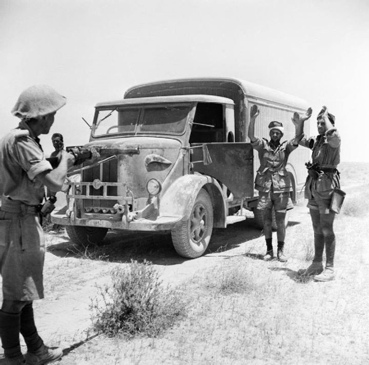 WW2Vehicles's tweet image. A British infantryman takes the surrender of the crew of an enemy supply truck in the Western Desert, 2 June 1942.
