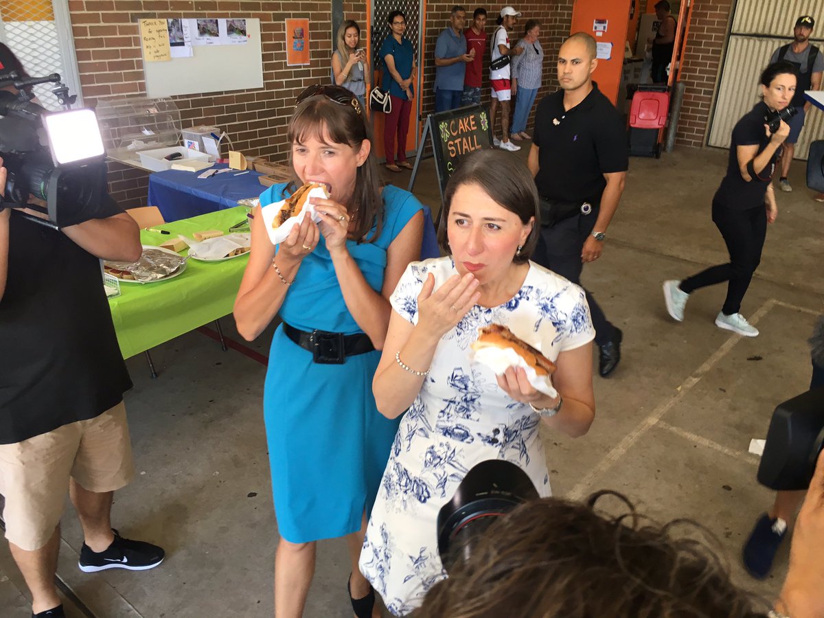 Sausage sandwich, sauce, a white dress and a media pack: Premier Gladys Berejiklian deftly navigates a precarious situation #nswvotes