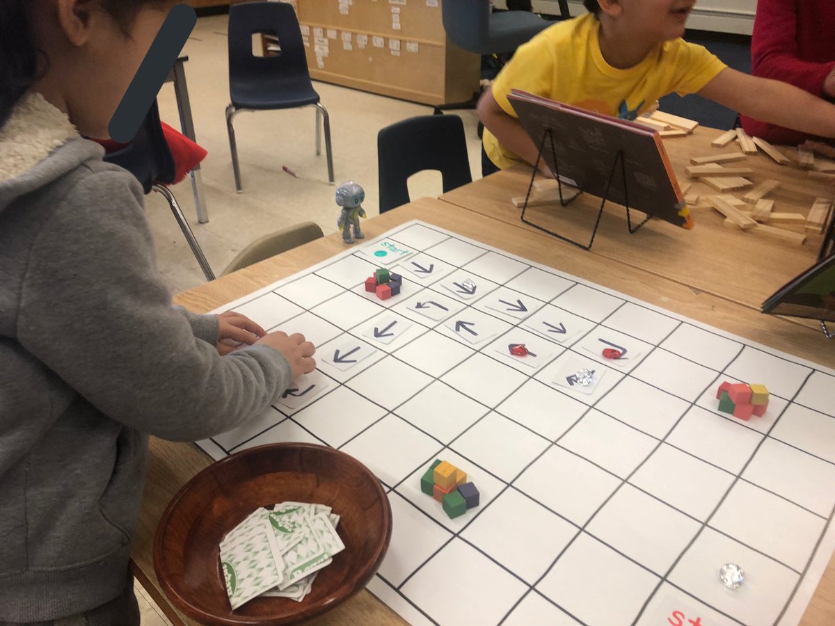 MsCDiep's tweet photo. This #DiscoveryRobot was a perfect addition to our #coding table. This @McDonaldsCanada #happymeal buddy is the perfect size for our grid. Ss wanted to add a code for “jump”, so we came up with a symbol together. #kindergarten #unpluggedcoding #STEM #responsivepedagogy https://t.co/ulZeRTdUoq