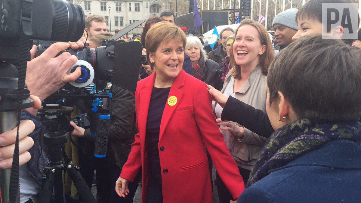 TomPilgrim10's tweet photo. Scotland’s First Minister Nicola Sturgeon leaving the stage in Parliament Square earlier after backing calls for a People’s Vote https://t.co/qE9OGPaIwA