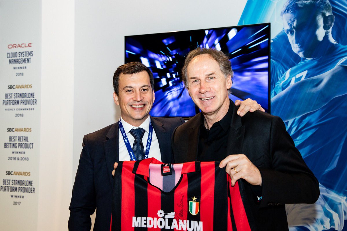 jacob_lo's tweet photo. With Franco Baressi at Optima stand during Betting on Football. The dedicated T-shirt will be part of our wall of fame at our Sevilla office https://t.co/nQadwrWI8s