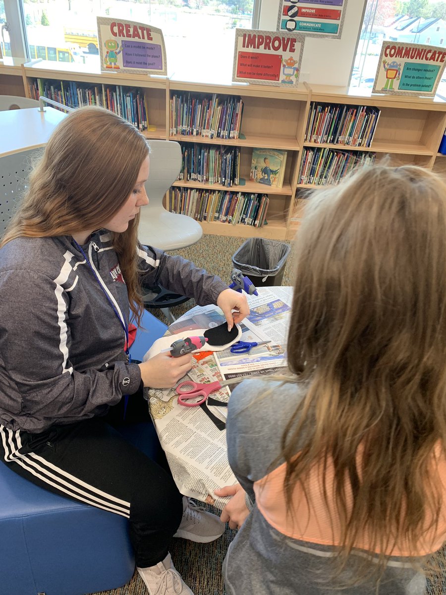 LibrariansNnps's tweet photo. @LibrariansNnps and early rising high school students are #NNPSProud in assisting students in making puppets to put in a puppet show. https://t.co/eRDSezqpwG