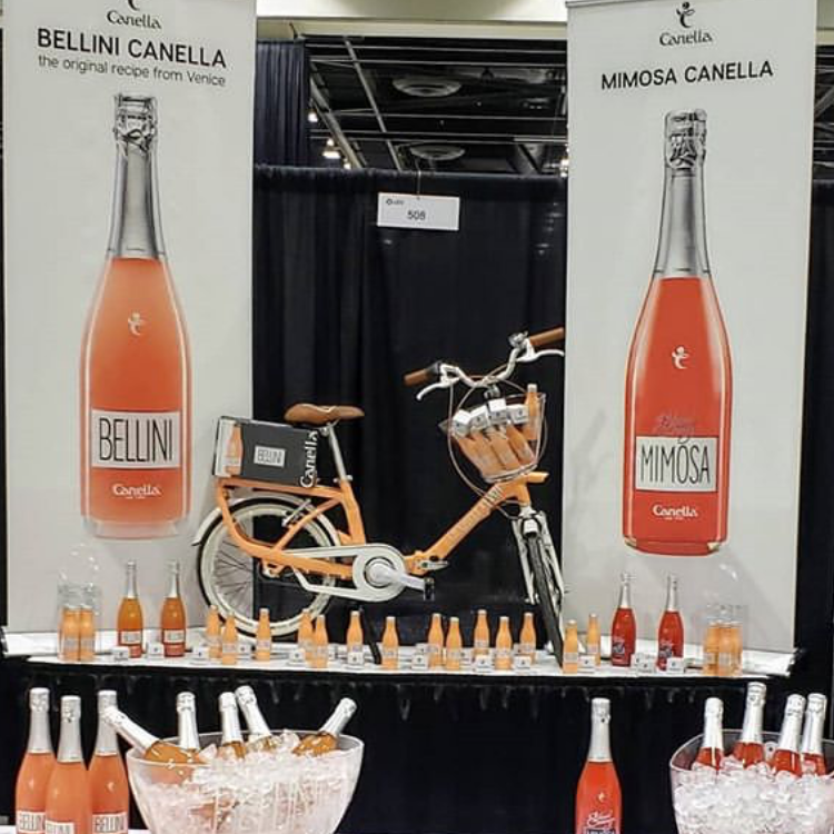 EmpsonCanada's tweet photo. Our rad Southern Alberta team NAILING the Bellini booth at Co-op Grape Escape in Calgary tonight! ๐๐๐#wineshow #yycwine #bellini #mimosa #thatbike #sweetdisplay #wineiswork #workisgood #grapeescape https://t.co/KngNTNq00y