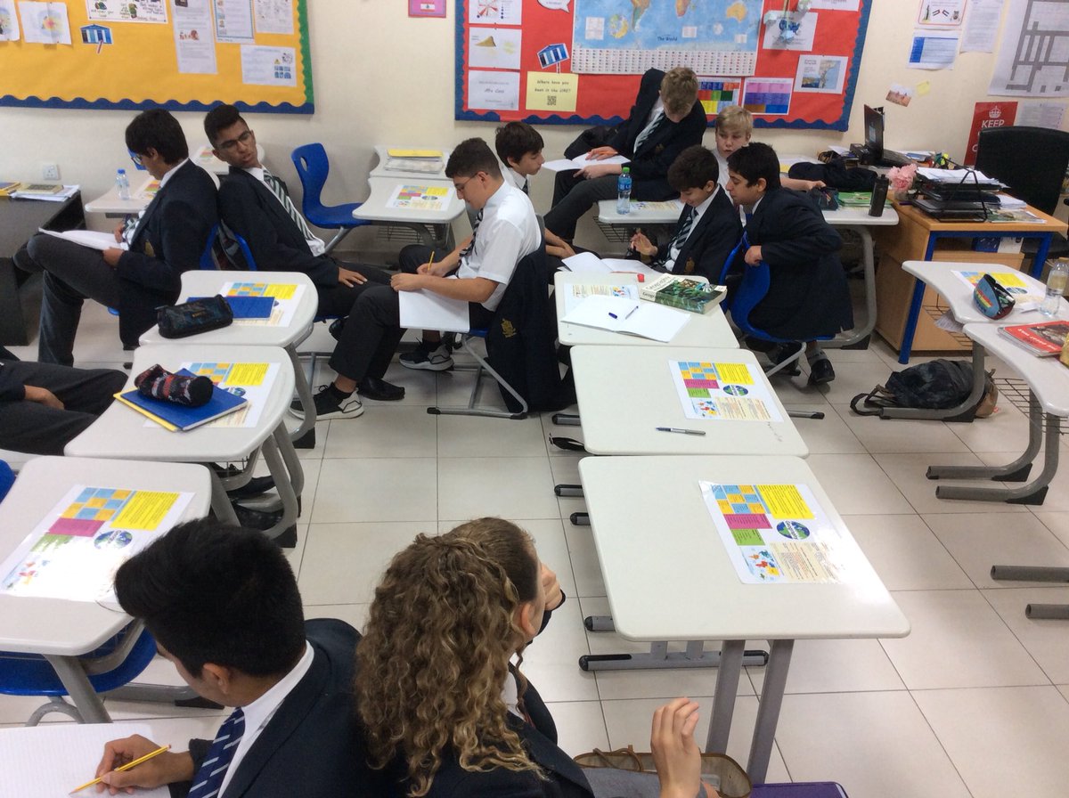 ReptonDXBGeog's tweet photo. Year 9 geography students playing ‘back to back’. They’re having to describe an image of an informal settlement to their partner who is sketching it. https://t.co/XEJcZ0MENK
