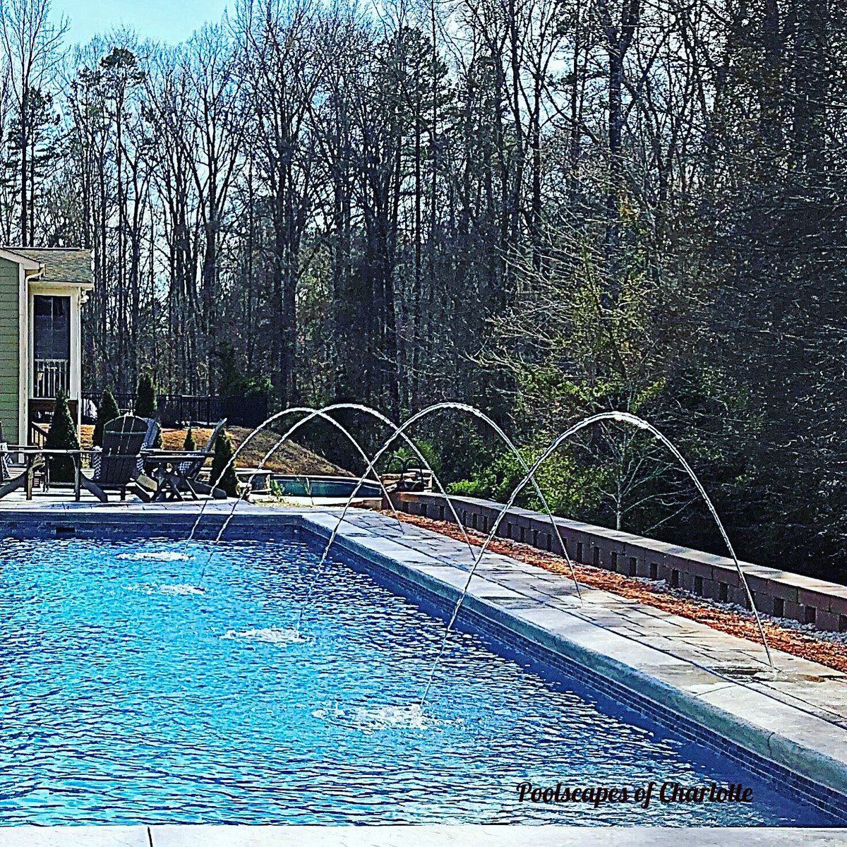 PoolscapesCLT's tweet image. The rhythm of dancing water. #deckjets #waterfeature #fiberglasspool #pooldesign #backyarddesign #familypool