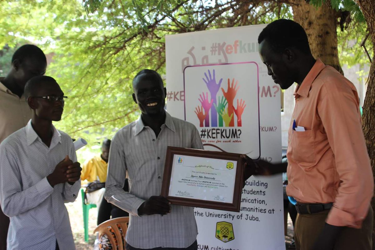 Kefkum's tweet photo. That time that @Kefkum, at one of their #teatalks, granted Upper Nile University colleagues a Certificate of Care and donated "dialogue benches" to them to cultivate a culture of #dialogue and #care #TeaTalks2019 https://t.co/3llzbszRaP