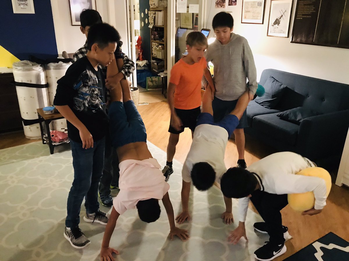 HHKSShackleton's tweet photo. The boarding week started with a bang this evening with a #boysofshackleton team building challenge! Well done to team Wild for taking the points in the Magic Carpet and Hands & Feet! @Harrow_HK @HeadHarrowHK #boysofcourage https://t.co/bxC2bQ4niV
