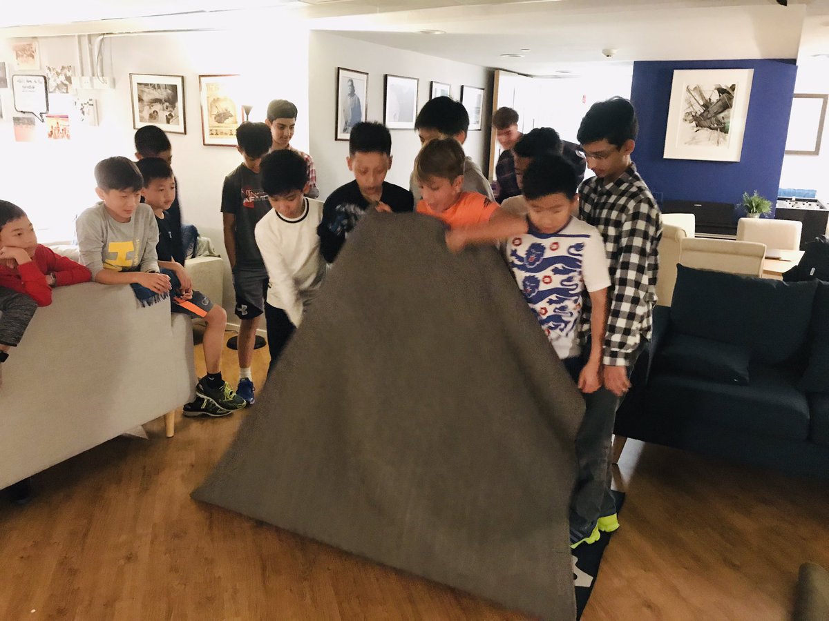 HHKSShackleton's tweet photo. The boarding week started with a bang this evening with a #boysofshackleton team building challenge! Well done to team Wild for taking the points in the Magic Carpet and Hands & Feet! @Harrow_HK @HeadHarrowHK #boysofcourage https://t.co/bxC2bQ4niV