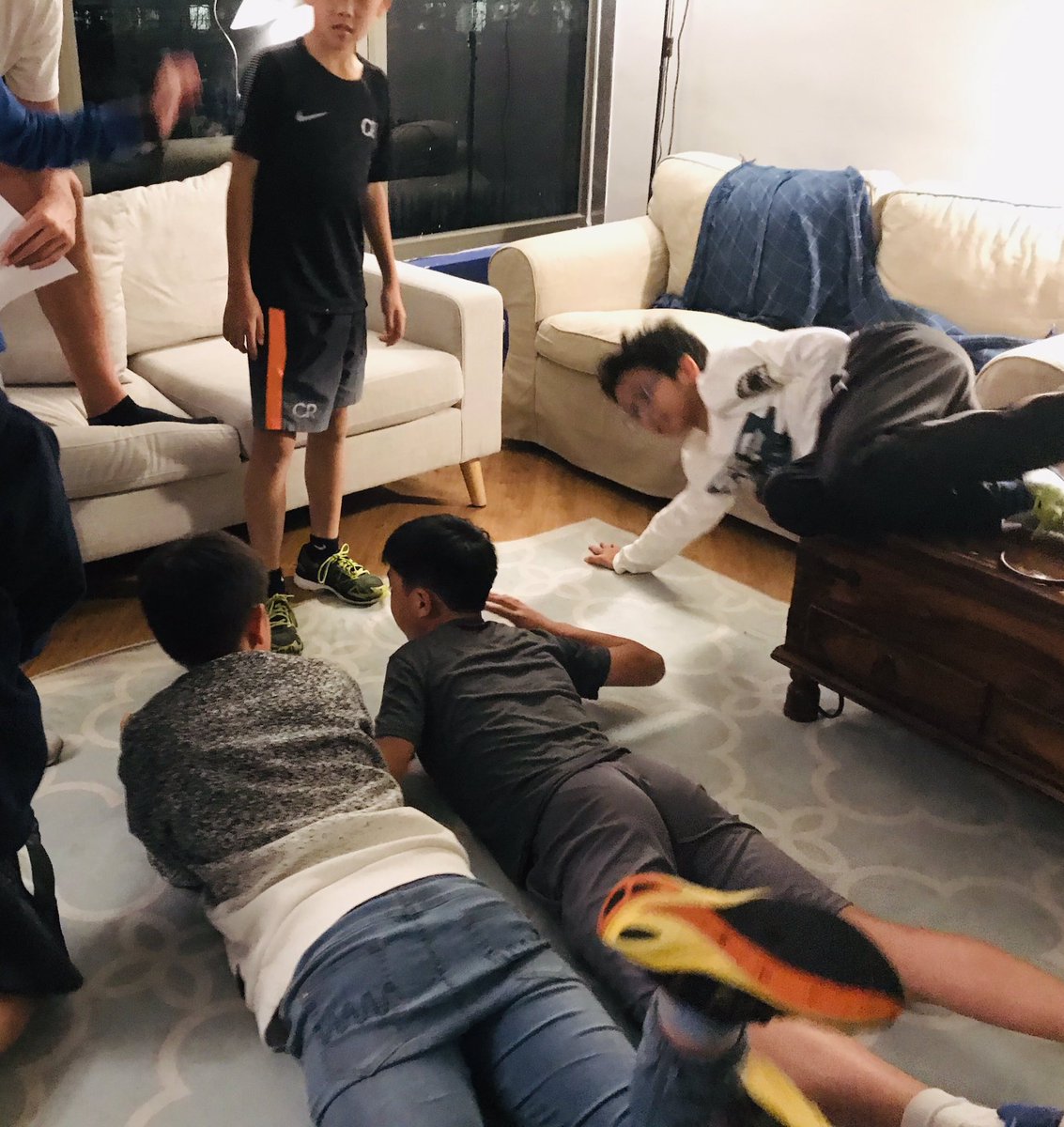 HHKSShackleton's tweet photo. The boarding week started with a bang this evening with a #boysofshackleton team building challenge! Well done to team Wild for taking the points in the Magic Carpet and Hands & Feet! @Harrow_HK @HeadHarrowHK #boysofcourage https://t.co/bxC2bQ4niV
