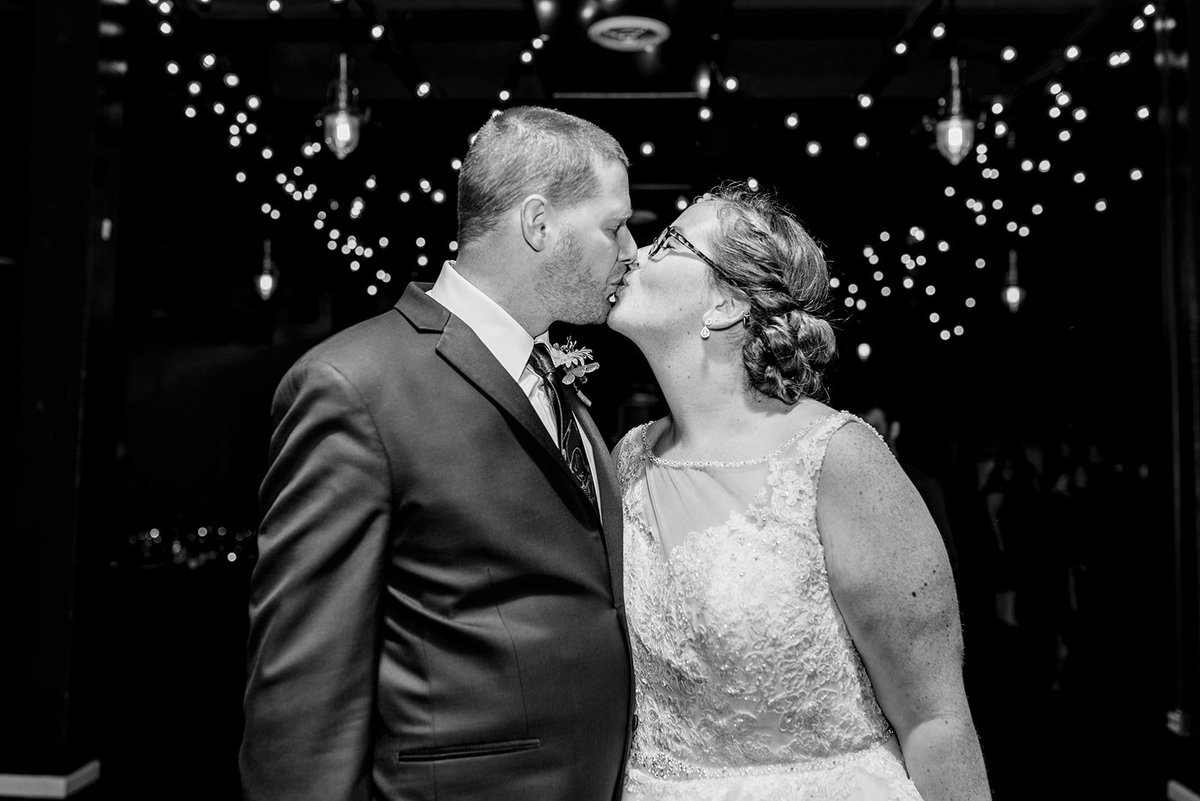 Sharing a kiss under the twinkle lights.

📷: Allison Mae Photography
