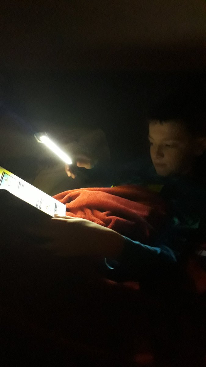 kujawa64's tweet photo. Liam reading by torchlight #cpsread @MrsCampbellP5C @CarronPrimary https://t.co/qUyydAFwki