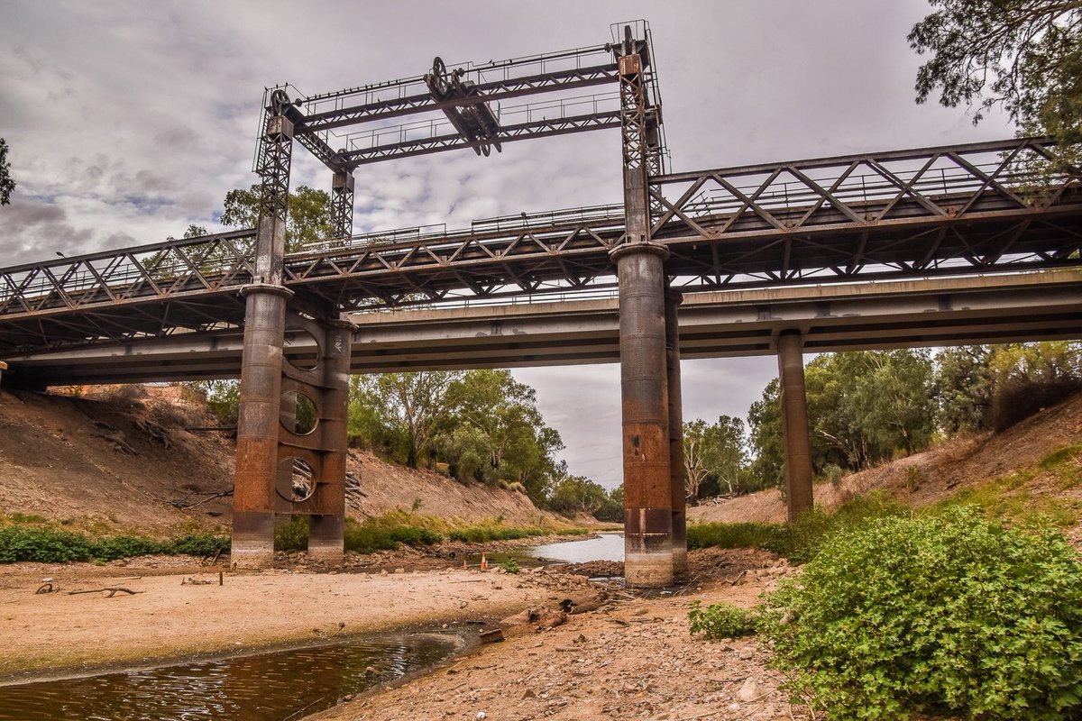 aptribunal's tweet photo. Today (Monday 25th) we are in Wilcannia to hear from the community about the past, present, and future of living on the Darling. Image: Wilcannia bridge over the Darling #barka #paaka.
#auspol #nswpol #mdbplan #mdb #basinplan #WaterIsLife https://t.co/NeKHWdnwRF