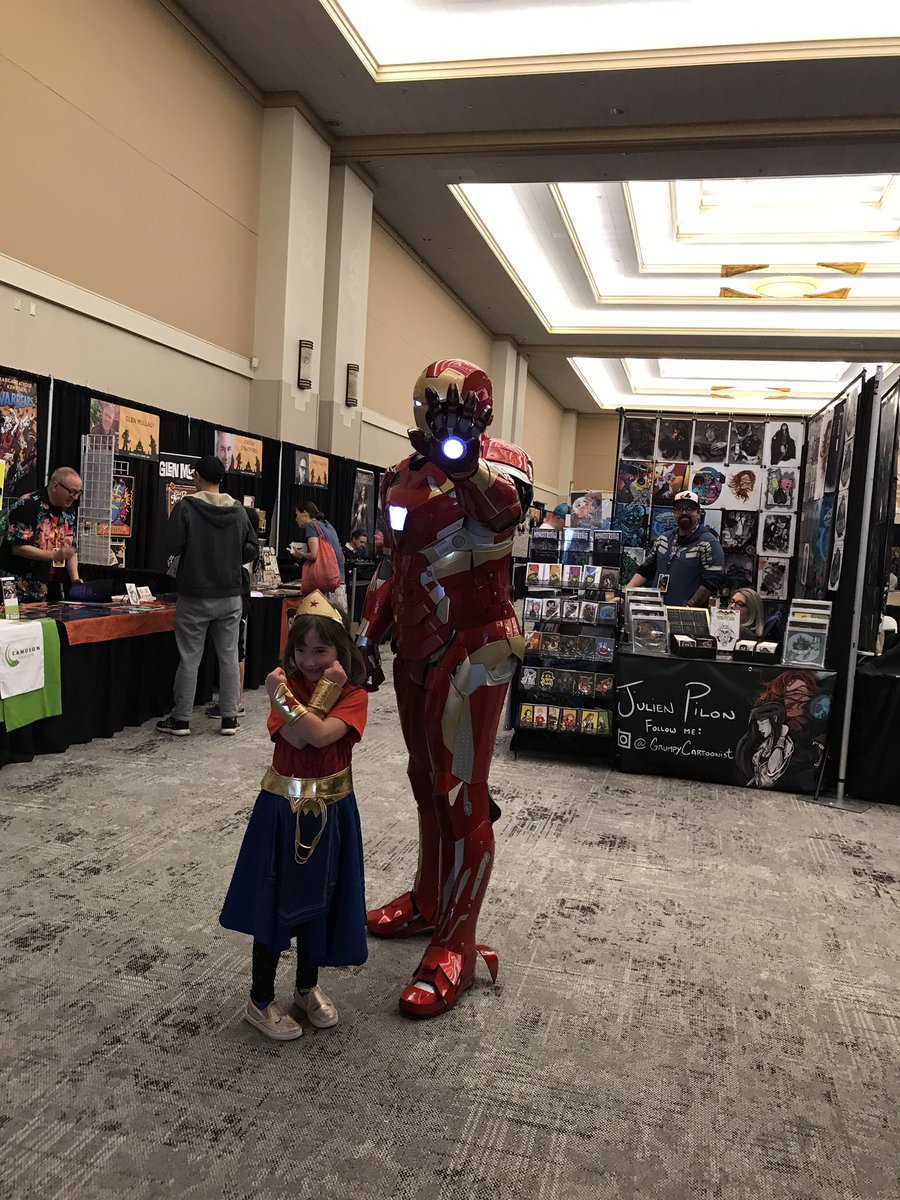DeucesSteve's tweet photo. My #IronMan suits first appearance at a fan convention and I got to fight alongside #WonderWoman. This little girl was super cute and excited for the suit. #CapCityComicCon https://t.co/7f9dyrWy79