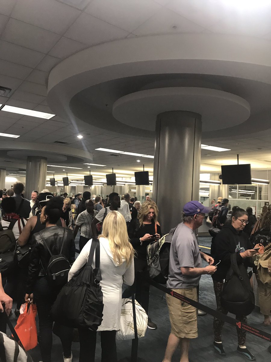 McfJewelry's tweet photo. What a s__it show!!  Line is 3 miles long and the TSA agent decides now is the time for his break?!!!!  Telling people “one more hour won’t hurt “ WTF!!  Atl airport get it together! #BOEING737MAX8 meltdown https://t.co/iNeul46Eqd