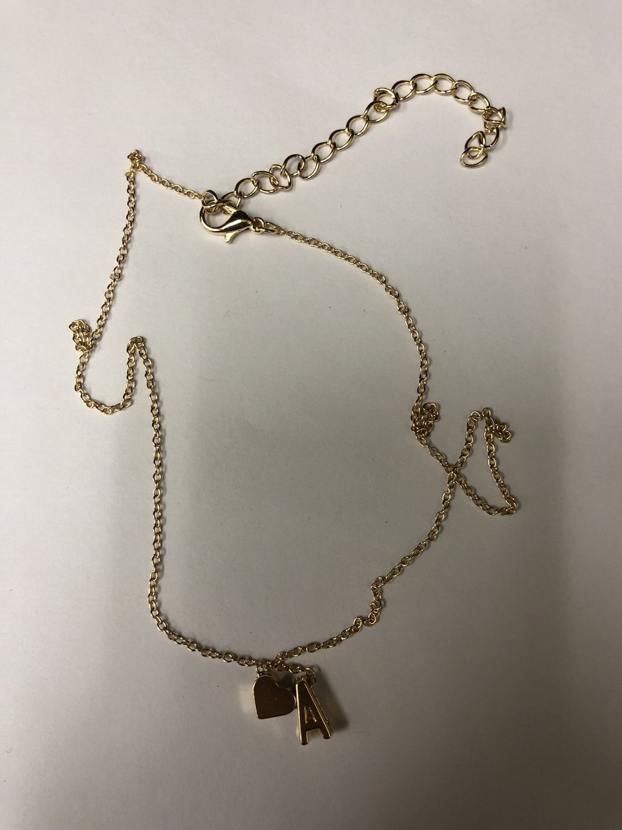 The_ReviewMan's tweet photo. This necklace is a nice to addition for my kid. The letter is a thick letter and is hefty enough. The gold looks nice and the heart is a nice addition as well. Got it on eBay at https://t.co/hV1XXrInfn and you can get any letter. https://t.co/OYfgjPSb84