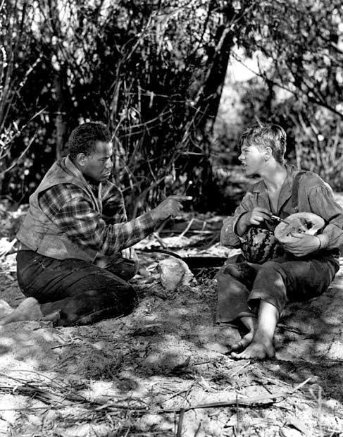 Today is International Day of Remembrance of the Victims of Slavery and the Transatlantic Slave Trade. Pictured are Rex Ingram and Mickey Rooney in The Adventures of Huckleberry Finn (1939). #InternationalDayOfRemembranceOfTheVictimsOfSlavery