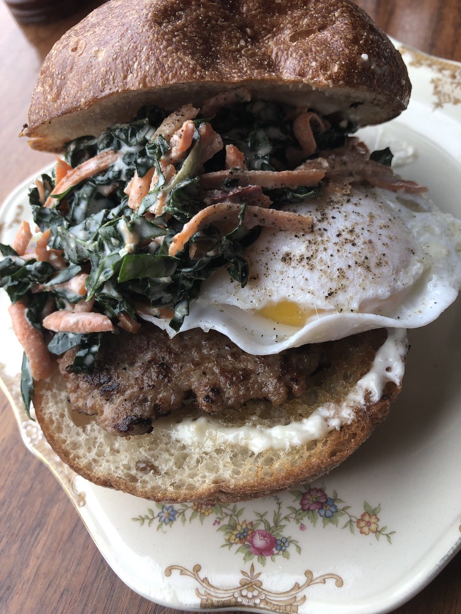 Duck egg sandwich - not a regular menu item, but we put it on special often. It’s a perfect brunch item. Rosemary brioche bun by @grandcentralbakery , hand made sausage, duck egg, our kale slaw, and garlic dressing. It’s the perfect amount of food for one. #trinketpdx #brunch